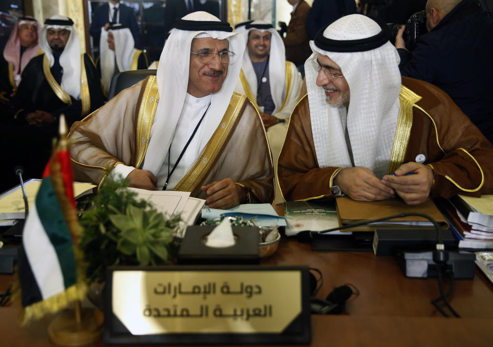 United Arab Emirates economy minister Sultan al-Mansouri, left, speaks with Mohammed al-Hashimi, right, the assistant and representative of the United Arab Emirates foreign minister, as they attend the opening session of the Arab foreign ministers meeting ahead of a weekend Arab Economic Summit, in Beirut, Lebanon, Friday, Jan. 18, 2019. The Arab Economic and Social Development Summit, or AESD, is being held in Lebanon for the first time amid sharp divisions in the country and among Arab countries. (AP Photo/Hussein Malla)