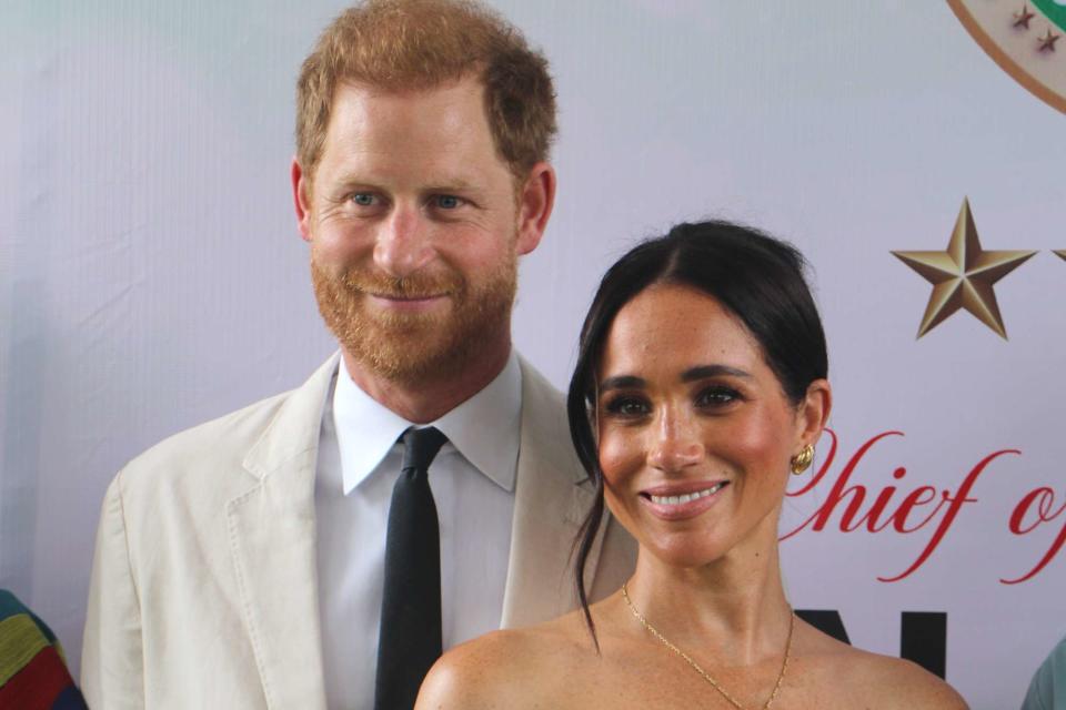 <p>Emmanuel Osodi/Anadolu via Getty</p> Prince Harry and Meghan Markle in Abuja, Nigeria