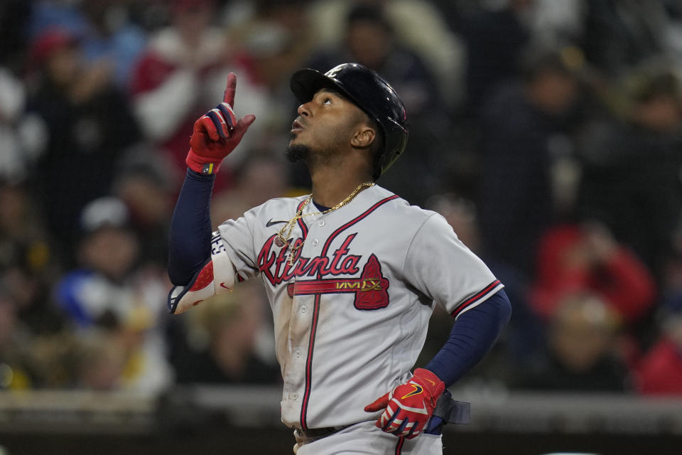 Atlanta Braves' Ozzie Albies celebrates after hitting a three-run home run during the eighth inning of a baseball game against the San Diego Padres, Tuesday, April 18, 2023, in San Diego. (AP Photo/Gregory Bull)