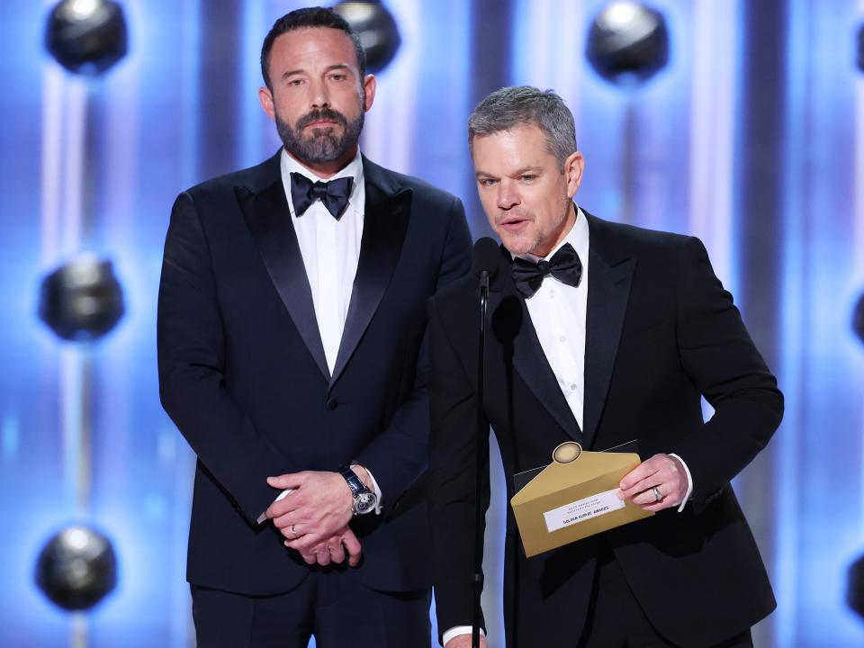 ben affleck and matt damon presenting an award at the golden globes in 2024