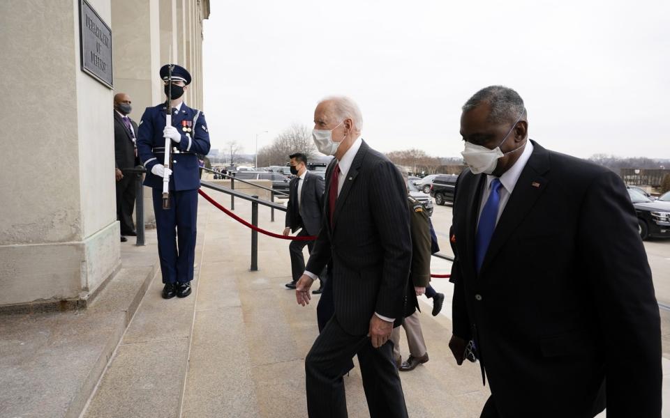 President Joe Biden and Lloyd Austin, U.S. secretary of defense, right, arrive at the Pentagon in Arlington, Virginia - AP