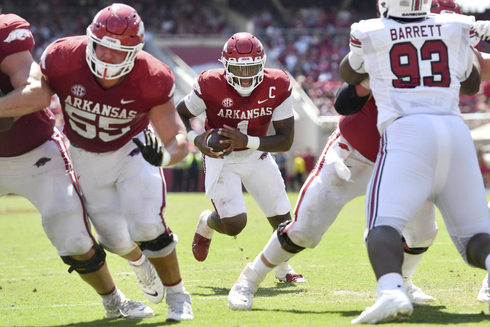 Arkansas quarterback KJ Jefferson (1) gets a block from offensive lineman Beaux Limmer (55) as he runs up the middle to score a touchdown against South Carolina during the second half of an NCAA college football game Saturday, Sept. 10, 2022, in Fayetteville, Ark. (AP Photo/Michael Woods)