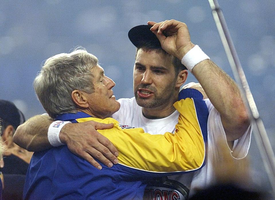 Dick Vermeil and Kurt Warner celebrate the first Super Bowl victory in Rams history, a 23-16 win over the Tennessee Titans in Super Bowl XXXIV.
