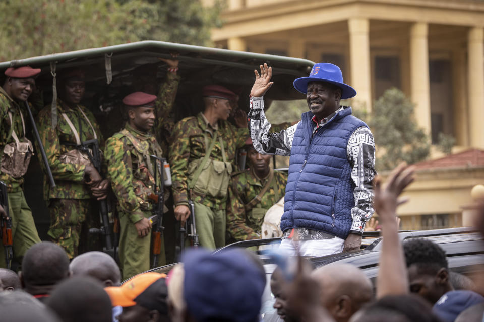 Presidential candidate Raila Odinga waves to supporters as he leaves the Supreme Court in Nairobi, Kenya Monday, Aug. 22, 2022. Kenya's losing presidential candidate Odinga filed a Supreme Court challenge to last week's election results Monday, starting the 14-day period in which the court must rule. (AP Photo/Ben Curtis)