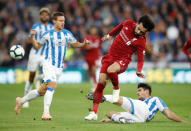 Soccer Football - Premier League - Huddersfield Town v Liverpool - John Smith's Stadium, Huddersfield, Britain - October 20, 2018 Liverpool's Mohamed Salah in action with Huddersfield Town's Christopher Schindler Action Images via Reuters/Carl Recine