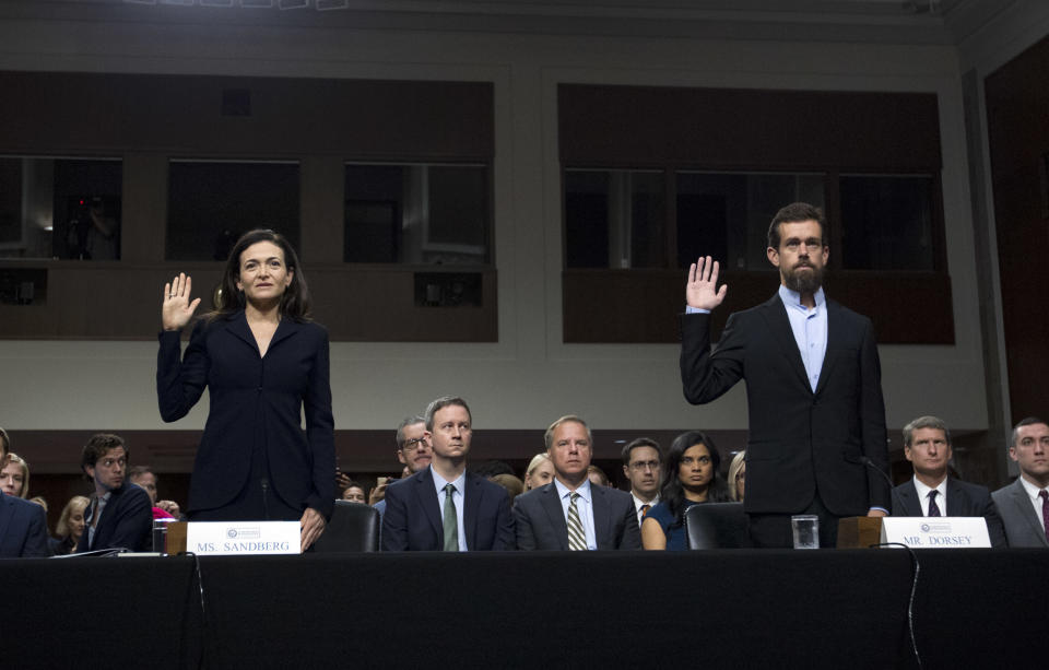 Facebook COO Sheryl Sandberg, left, accompanied by Twitter CEO Jack Dorsey are sworn in before the Senate Intelligence Committee hearing on ‘Foreign Influence Operations and Their Use of Social Media Platforms’ on Capitol Hill, Wednesday, Sept. 5, 2018, in Washington. (AP Photo/Jose Luis Magana)