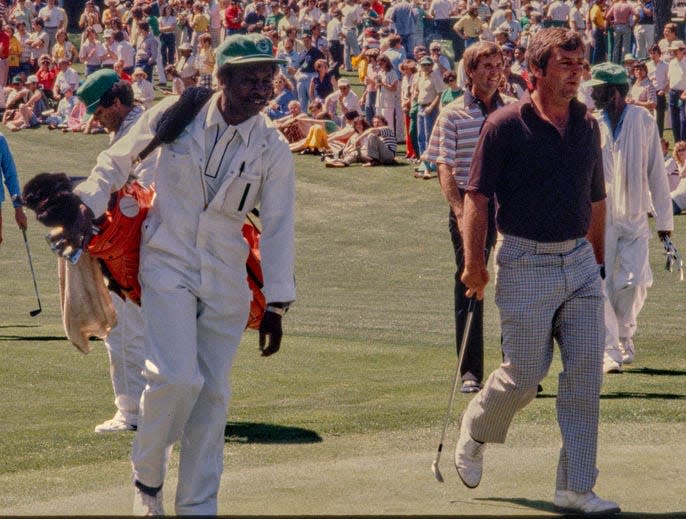 Golfer Fuzzy Zoeller and caddie Jariah Beard during the 1980 Masters. The pair won the 1979 tournament in Zoeller's Augusta debut.