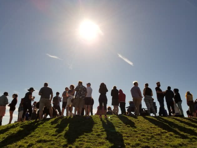 Skywatchers gather at Seattle’s Gas Works Park to watch the progress of 2017’s solar eclipse. (GeekWire Photo)