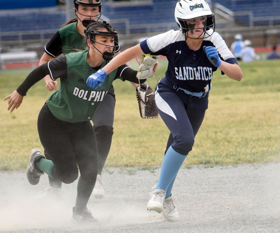 D-Y shortstop Gabby Tanon runs down CeCe Donovan of Sandwich between second and third followed by second baseman Alexa Barboza.