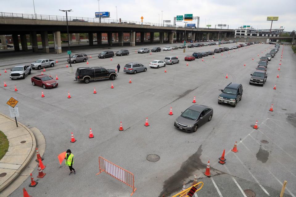 Cars line up to receive food during a donation drive in Baltimore. 