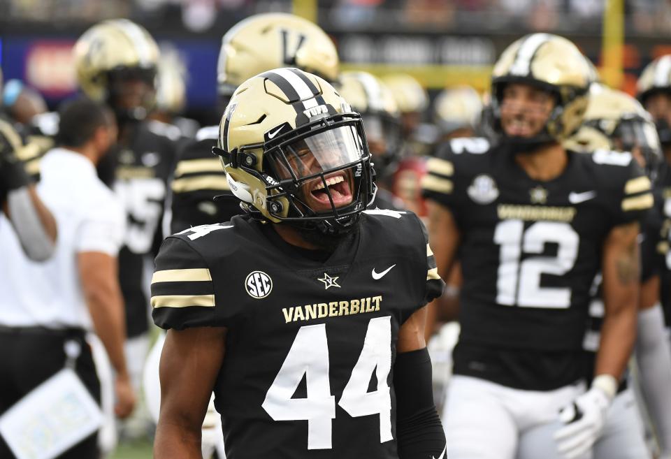 Oct 23, 2021; Nashville, Tennessee, USA; Vanderbilt Commodores defensive back Alan Wright (44) celebrates after an interception during the second half against the Mississippi State Bulldogs at Vanderbilt Stadium. Mandatory Credit: Christopher Hanewinckel-USA TODAY Sports