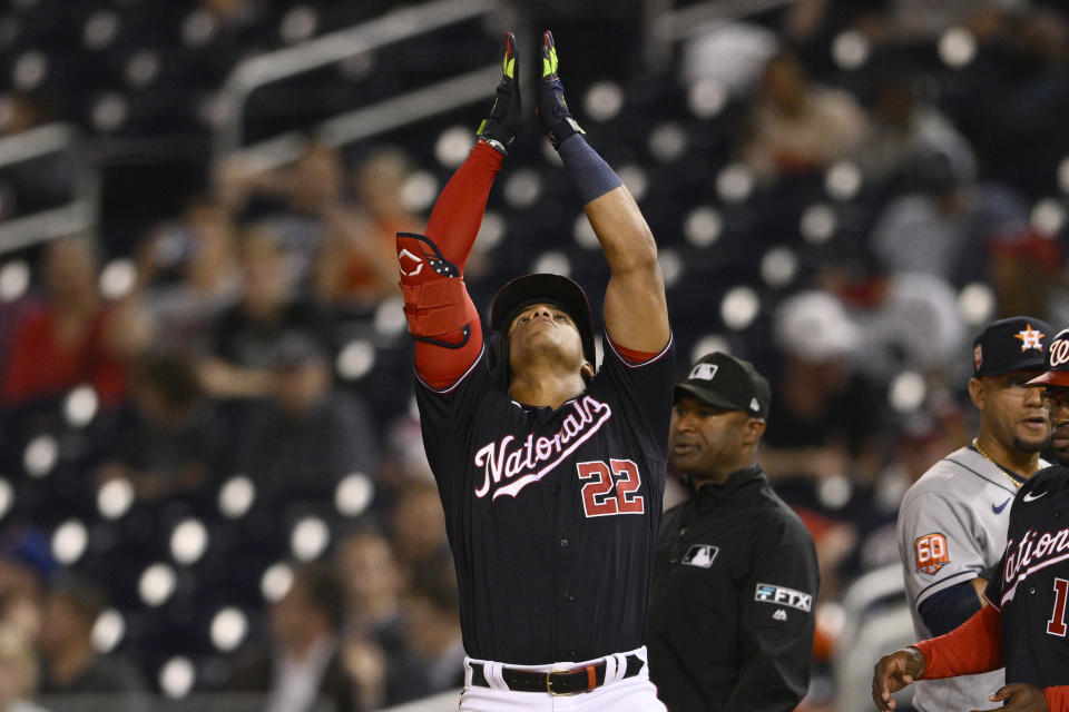 Washington Nationals' Juan Soto gestures after a single against the Houston Astros during the sixth inning of a baseball game Friday, May 13, 2022, in Washington. (AP Photo/Nick Wass)