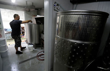 Radek Spacil, co-owner of the "Smart Brewery", brews a beer in a portable brewery built in a standard shipping container, in Prague, Czech Republic, September 2, 2017. Picture taken September 2, 2017. REUTERS/David W Cerny