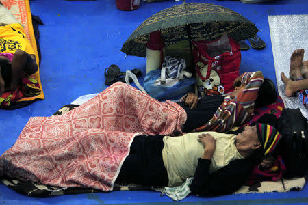 Evacuees from the coastal villages take shelter inside an evacuation center as Typhoon Haima locally name Lawin approaches, in Alcala town, Cagayan province, north of Manila October 19, 2016. REUTERS/Stringer