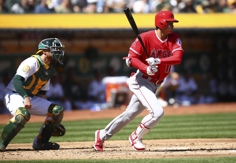 After a tough spring, Shohei Ohtani came through with a hit in his first at-bat. (AP Photo)