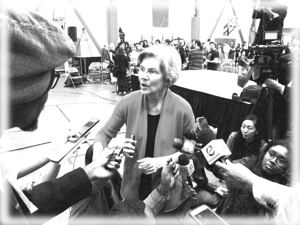 Warren meets the press in Reno, Nev., April 6, 2019. (Photo: Scott Sonner/AP; digitally enhanced by Yahoo News)