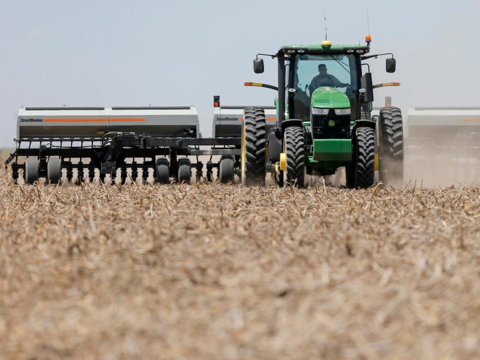 A sorghum farmer in Kansas at work in 2015, who uses the aquifer for his farm.