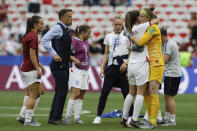 England head coach Philip Neville celebrates with players at the end of the Women's World Cup Group D soccer match between England and Scotland in Nice, France, Sunday, June 9, 2019. Ellen White got England off to a winning start at the Women's World Cup, curling in a shot to give the 2015 semifinalists a 2-1 victory against tournament newcomers Scotland. (AP Photo/Claude Paris)