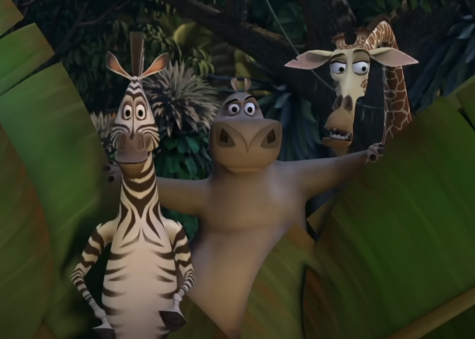 Animated characters Marty the zebra, Alex the lion, and Melman the giraffe from the movie "Madagascar" are shown together smiling