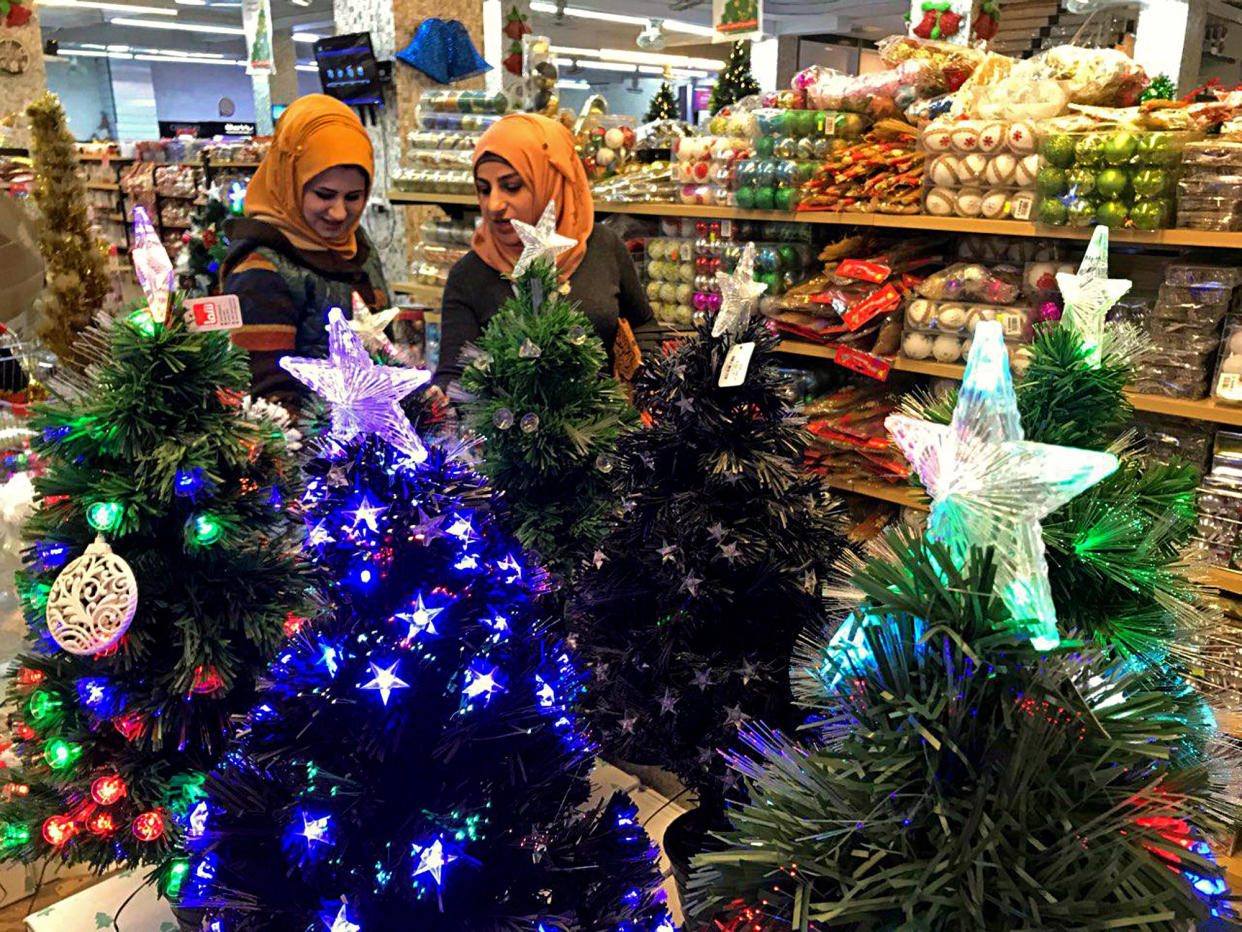 Two women in Iraq shop on Christmas Eve. (Photo: Associated Press)