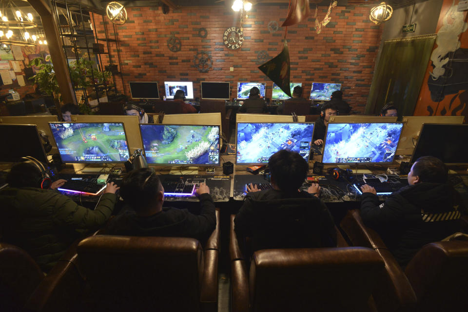 CORRECTS NUMBER OF GAMES TO 105 - People play online games in an internet cafe in Fuyang in central China's Anhui province Friday, March 1, 2019. China's authority in charge of press and publications has approved 105 online games, saying it fully supports the industry after newly proposed curbs caused massive losses for major game companies. The National Press and Publication Administration issued a statement on its Weibo social media account Monday, Dec. 25, 2023, saying the approvals demonstrate active support for the development of online games. (Chinatopix via AP)