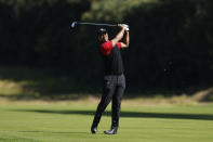 Tiger Woods hits from the fairway on the 12th hole during the final round of the Genesis Invitational golf tournament at Riviera Country Club, Sunday, Feb. 19, 2023, in the Pacific Palisades area of Los Angeles. (AP Photo/Ryan Kang)