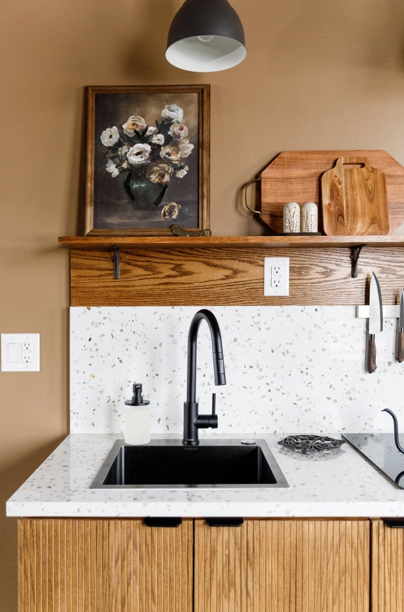 Terrazzo countertops in neutral kitchen.