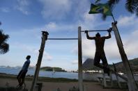 A man exercises in front of the Guanabara Bay after authorities announced measures due to the outbreak of coronavirus disease (COVID-19), in Rio de Janeiro