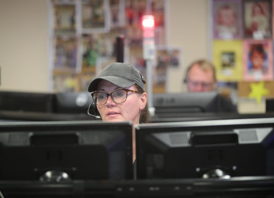 Sylvia Ransweiler, an emergency dispatcher for Norton, Copley and Barberton, talks with a caller.