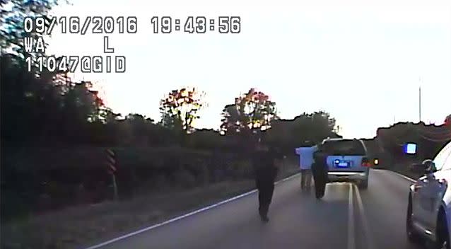 Footage from a police car shows Terrence Crutcher with his arms raised, appearing to follow police directions. Photo: AP