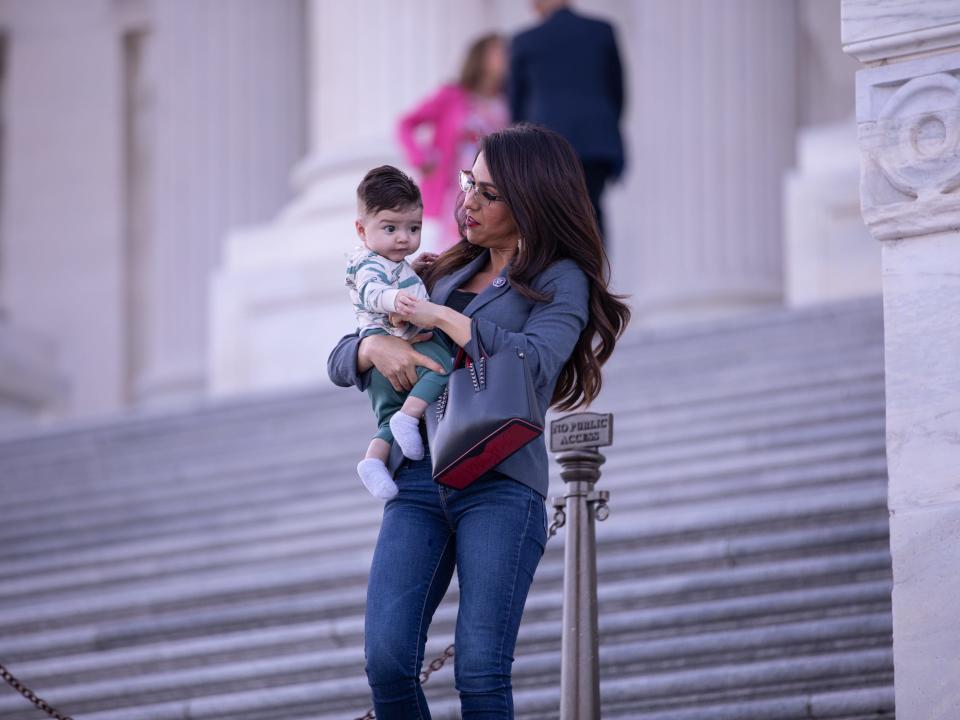 Lauren Boebert holds her grandson on the steps of the Capitol