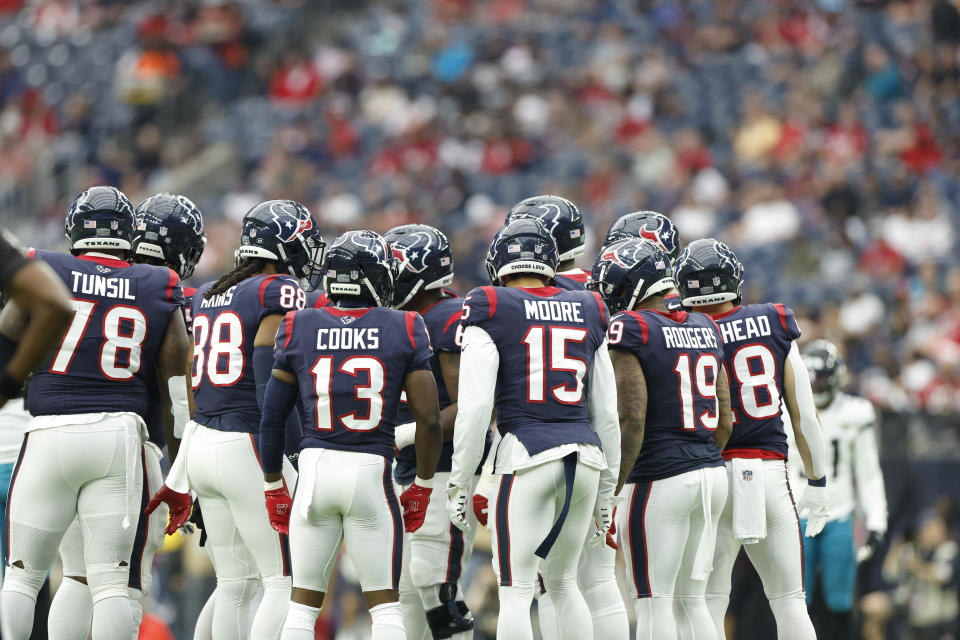 Houston Texans offensive huddle including Brandin Cooks (13) Chris Moore (15) Laremy Tunsil (78) and others during an NFL football game against the Jacksonville Jaguars on Sunday, January 1, 2023, in Houston. (AP Photo/Matt Patterson)