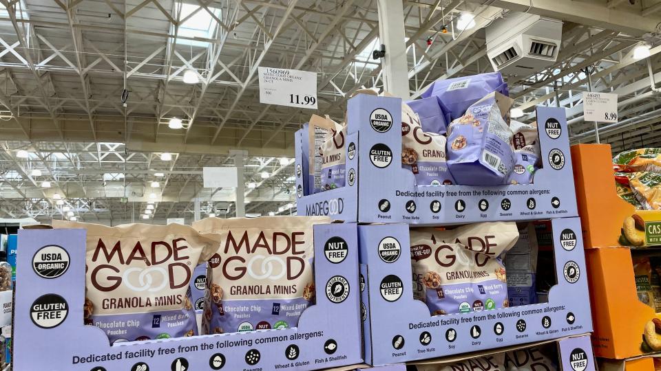 MadeGood granola in bags within purple boxes in a costco display