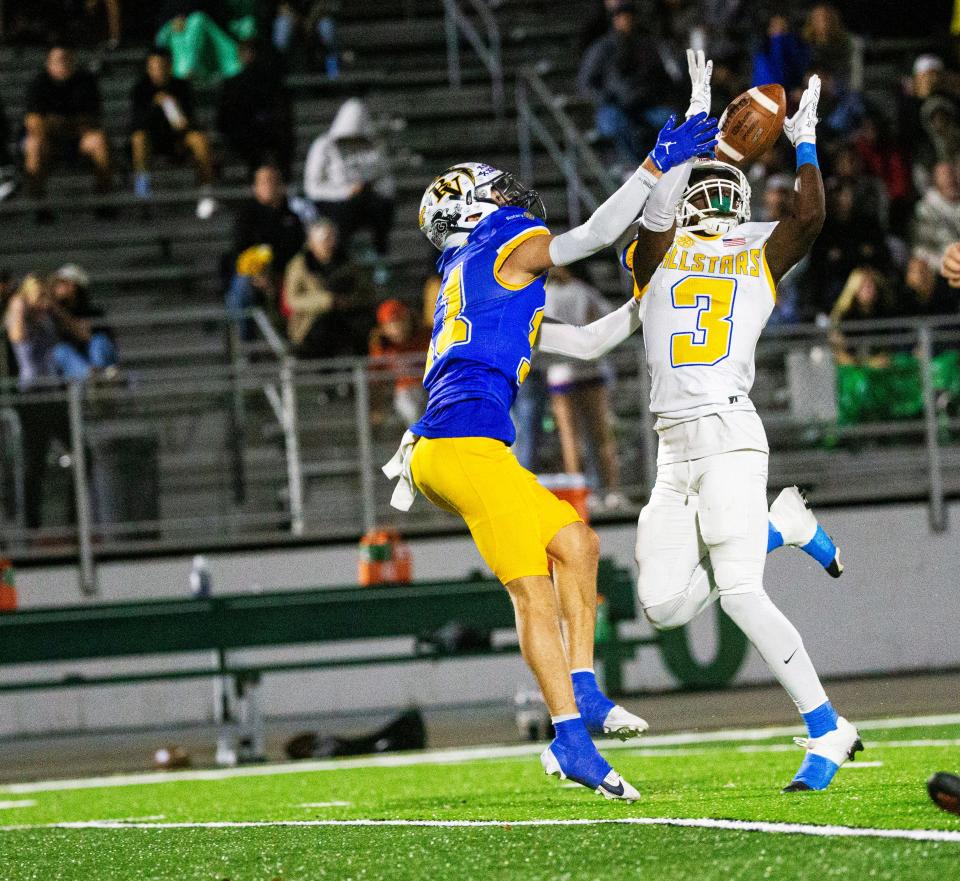 Eric Fletcher of the Gold Team comes down with a huge catch during a game against the Blue Team in the Rotary South All Star game at Fort Myers High School on Wednesday, Dec. 13, 2023. The Gold team won in a thriller.