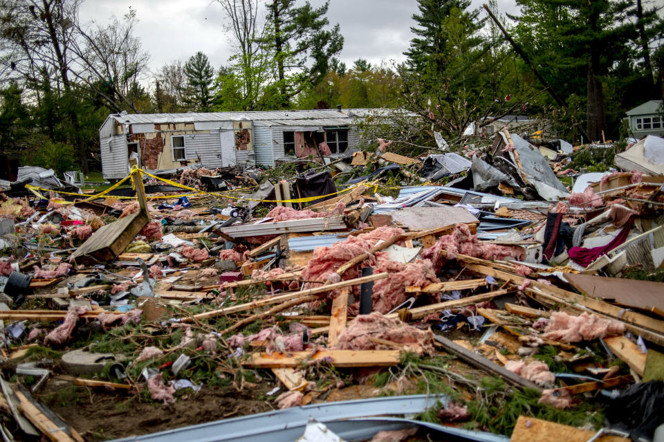 Rubble and debris lie scattered after a tornado touched down a day earlier in Nottingham Forest Mobile Home Park, Saturday, May 21, 2022, in Gaylord, Mich. (Jake May/MLive.com/The Flint Journal via AP)