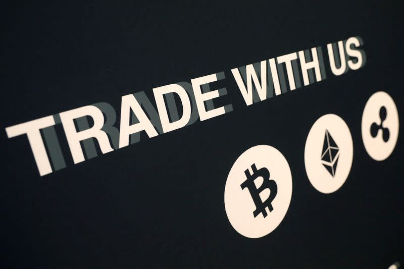 FILE PHOTO: A message on a vendor's booth is seen on display at the Consensus 2018 blockchain technology conference in New York City