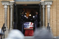 Capitol Police Officers carry the casket of their fellow officer, the late William "Billy" Evans into St. Stanislaus Kotska Church in Adams, Mass., for his funeral on Thursday, April 15, 2021. Evans was killed this month when a driver struck him and another officer at a barricade outside the Senate. (Stephanie Zollshan/The Berkshire Eagle via AP)