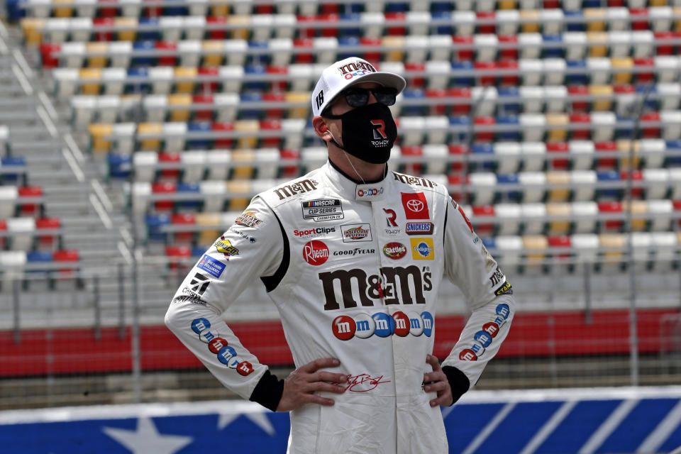 Driver Kyle Busch watches during qualifying for the NASCAR Cup Series auto race at Charlotte Motor Speedway Sunday, May 24, 2020, in Concord, N.C. (AP Photo/Gerry Broome)