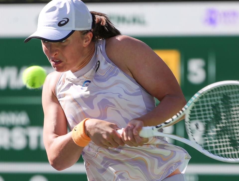 Iga Swiatek hits a shot during her quarterfinal victory over Sorona Cirstea during the BNP Paribas Open at the Indian Wells Tennis Garden in Indian Wells, Calif., March 16, 2023.