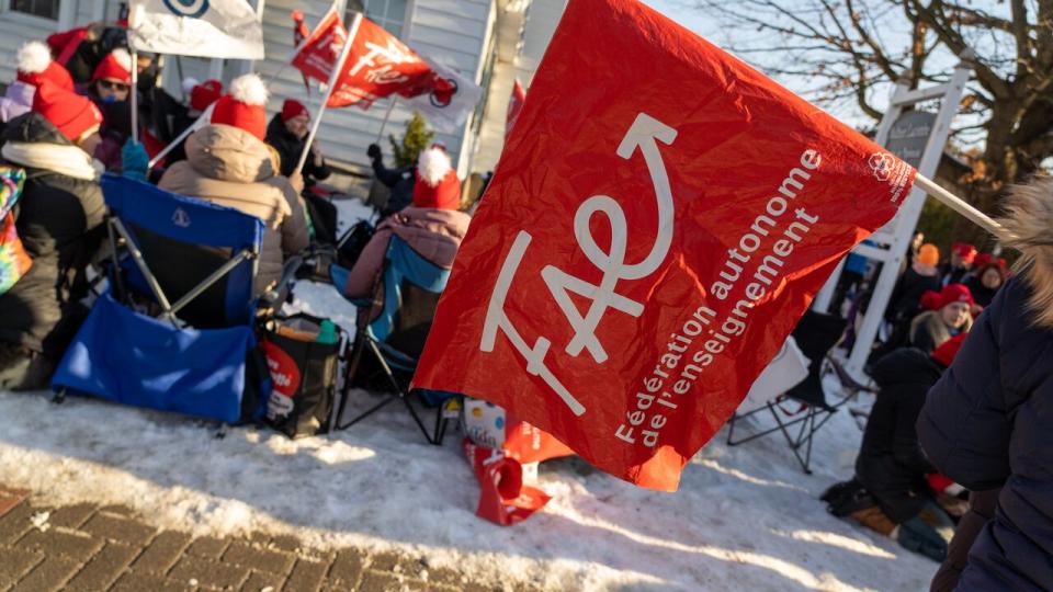 Striking western Quebec public sector workers outside Papineau CAQ MNA Mathieu Lacombe's office Dec. 15, 2023.