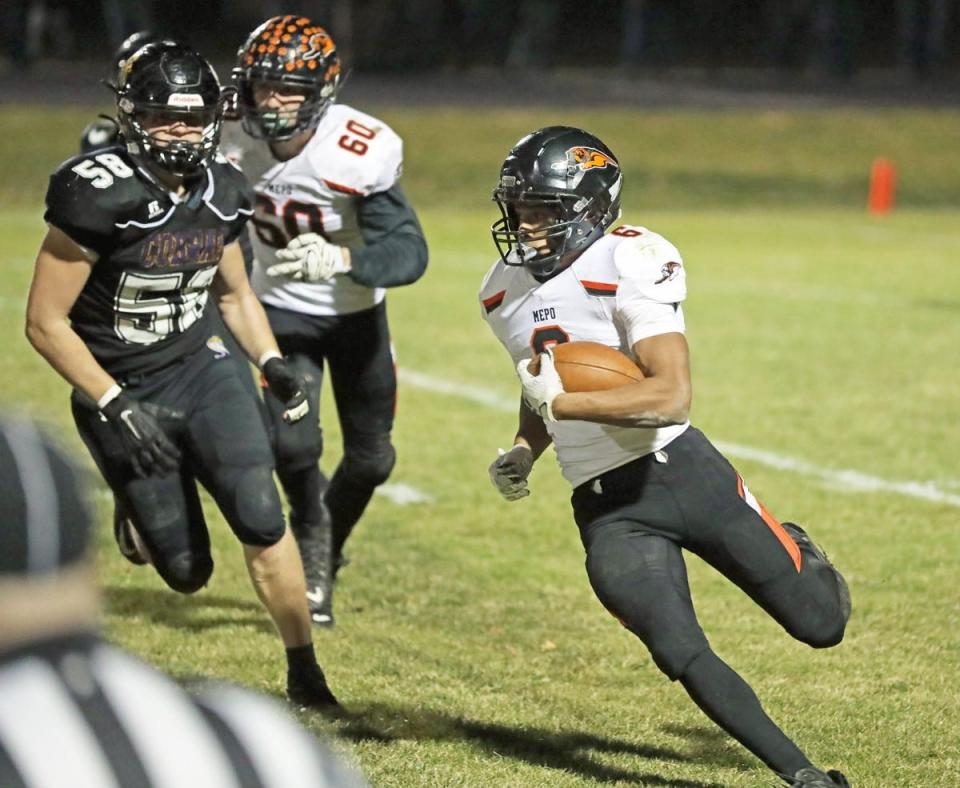 Anthony Isley turns upfield for yardage for Mediapolis on Friday.