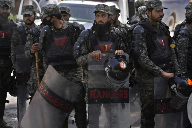 Paramilitary troops take position to ensure security at the premises of Islamabad High court, where Pakistan's former Prime Minister Imran Khan is due to appear, in Islamabad, Pakistan, Friday, May 12, 2023. A high court in Islamabad has granted former Prime Minister Imran Khan a two-week reprieve from arrest in a graft case and granted him bail on the charge. (AP Photo/Anjum Naveed)