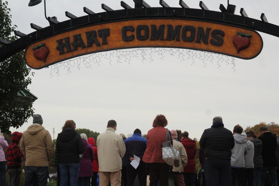 People gather for a vigil in Hart, Mich., on Sunday, Oct. 24, 2021, to pray for the return of 17 members of a missionary group who were kidnapped by a gang in Haiti more than a week ago. Among those taken were four children and a parent from Hart. (AP Photo/Anna Liz Nichols)