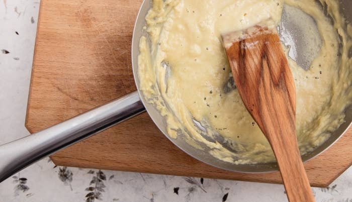 Mixing a roux in a sauce pan.