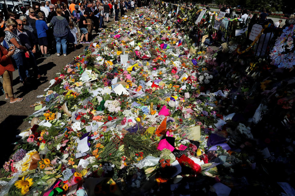 People visit a memorial site for victims of Friday’s shooting, in front of Christchurch Botanic Gardens. Source: Reuters