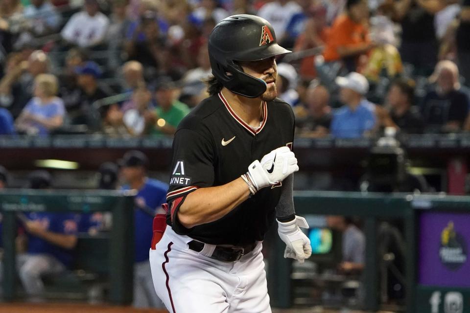 Arizona Diamondbacks' Corbin Carroll pumps his first home run against the New York Mets during the first inning of a baseball game Tuesday, July 4, 2023, in Phoenix. (AP Photo/Darryl Webb)