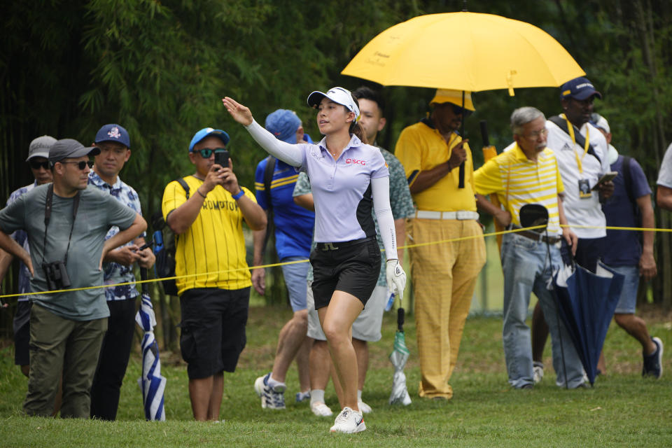 Atthaya Thitikul of Thailand gestures at the 18th hole during the third round of the LPGA Maybank Championship in Kuala Lumpur, Malaysia, Saturday, Oct. 28, 2023. (AP Photo/Vincent Thian)