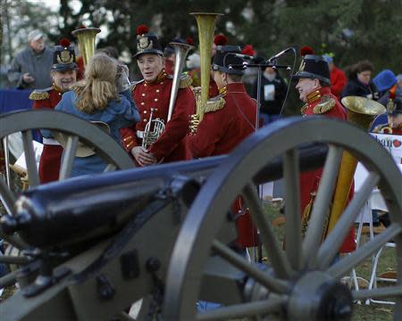 Members of President Lincoln's Own Band from Kentucky gather at the Gettysburg National Cemetery in Pennsylvania November 19, 2013, the burial ground for Civil War Union soldiers in which U.S. President Abraham Lincoln travelled to in 1863 to deliver a few concluding remarks at a formal dedication. REUTERS/Gary Cameron