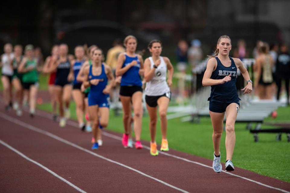 Reitz’s Cordelia Hoover leads in the 1600 meter run during the 2024 Southern Indiana Athletic Conference Girls Track & Field meet at Central High School in Evansville, Ind., Wednesday, May 1, 2024.