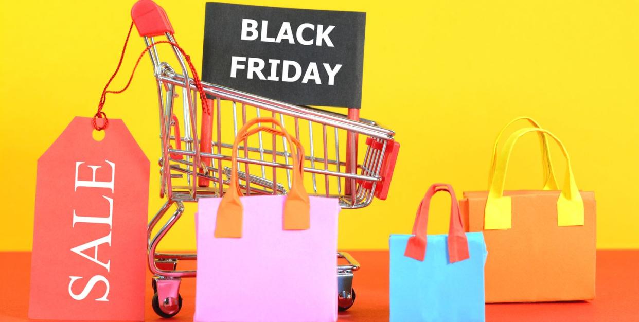 illustration of trolley with black friday sign and shopping bags